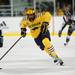 Michigan freshman right wingman Cristoval Nieves skates with the puck in the game against Michigan State on Friday. The Wolverines won 5-1. Daniel Brenner I AnnArbor.com